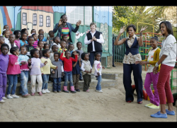 Michelle Obama and her daughters visit the Emthonjeni Community Center in Johannesburg