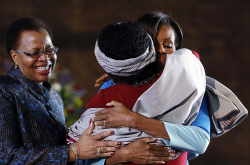 Michelle Obama embraces woman with Love