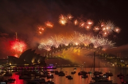 The Sydney Harbour Bridge looks impressive surrounded by colourful fireworks.jpg