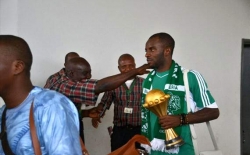 Sunday Mba with the AFCON Trophy.jpg