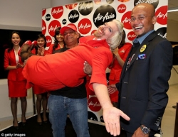 Tony Fernades carrying Richard like he would carry a lady.jpg