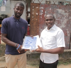 L-R Deyo Adegboyega-Star official presents iPad to Nebo Afam.jpg
