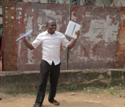 Excited Nebo Afam displays his iPad.JPG