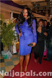 Ini Edo dazzles in a cobalt blue dress. Love the red shoes