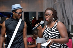0004-Festival-News-BEZ-hands-the-mic-to-audience-member-who-wows-the-audience-with-her-vocal-prowess