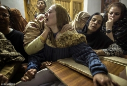0007-241989D200000578-2875729-A_mother_mourns_her_son_Mohammed_Ali_Khan_15_a_student_who_was_k-a-25_