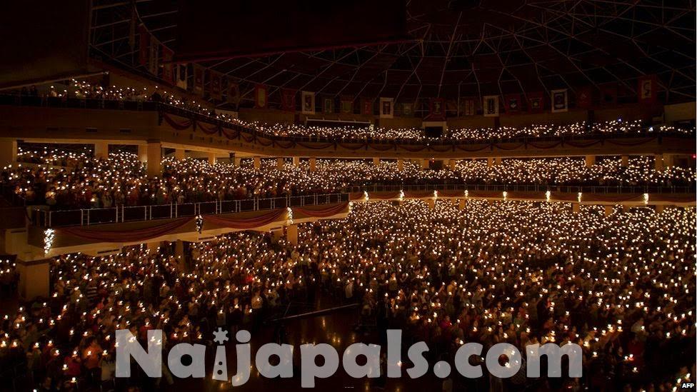 0011-Thousands_of_Christians_hold_candles_during_a_mass_in_Surabaya_Indonesia_which_is_also_the_most